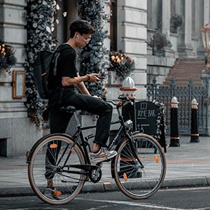 Boy in the city on a city bike